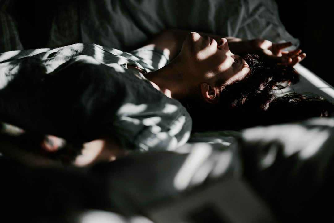 Woman resting, illustrating healthy sleep, recovery, and whole-person wellness